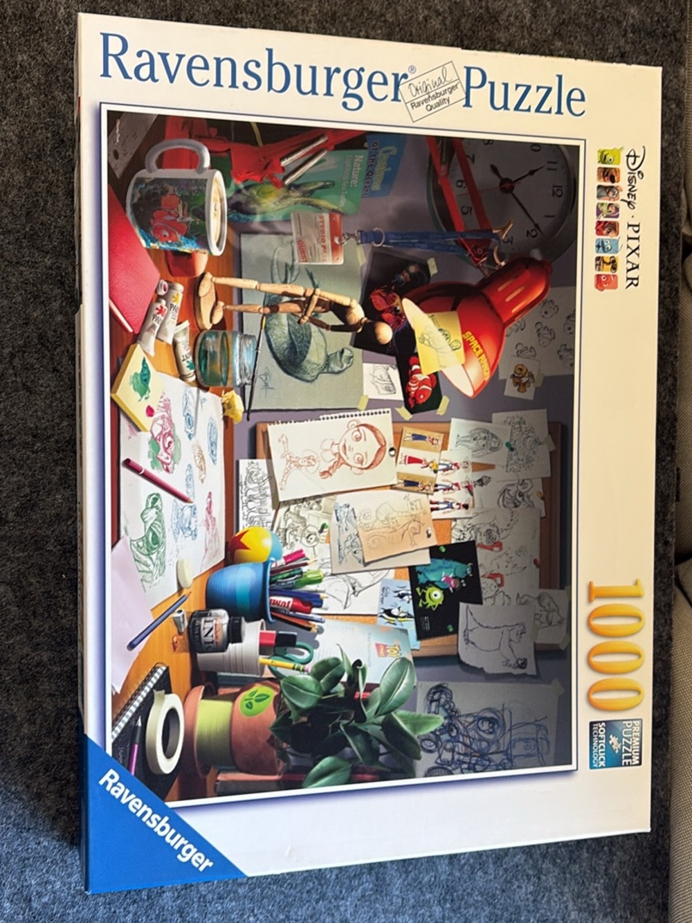 Ravensburger Pixar Artist Desk Puzzle – Red, Blue, Green, Yellow